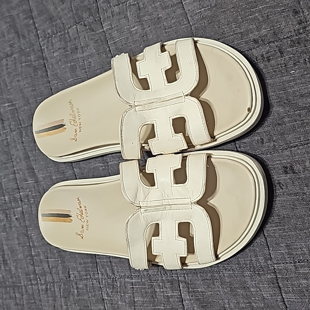 Sam Edelman slide on sandals with leather detail.